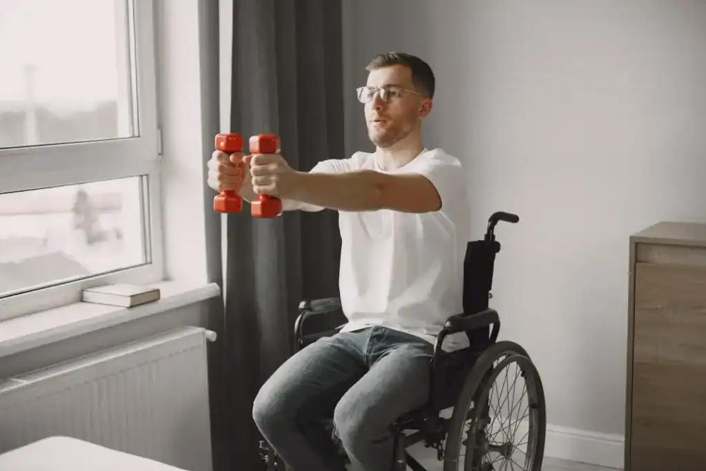 Empowering Weight Loss: A Comprehensive Guide for Individuals with Disabilities 1 Image of man doing exercise in his wheelchair to aid weight loss Brighton