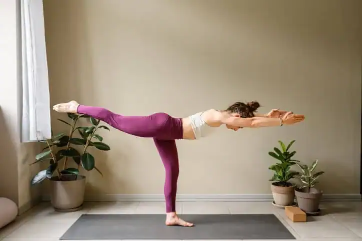 Woman doing Yoga exercise Brighton to help with toning the body. 