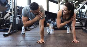 Image of man and woman doing Cardio Brighton to tone their arms. 